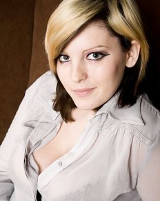 Plump girl undresses and shows her charms