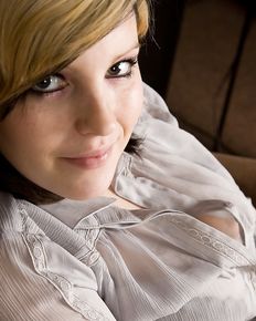 Plump girl undresses and shows her charms