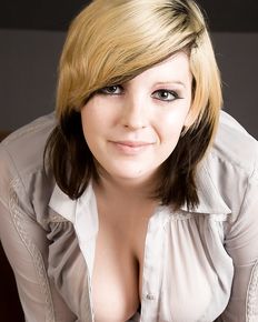 Plump girl undresses and shows her charms