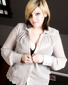 Plump girl undresses and shows her charms