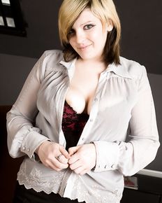 Plump girl undresses and shows her charms