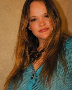 Young Kissy in blue blouse