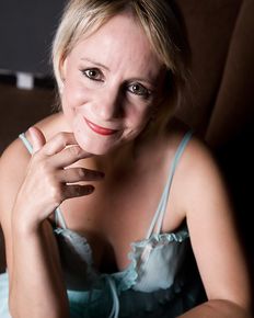 Tiffany is posing in blue negligee