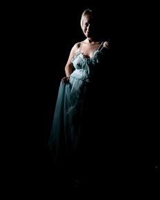 Tiffany is posing in blue negligee