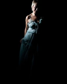 Tiffany is posing in blue negligee