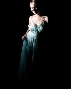 Tiffany is posing in blue negligee