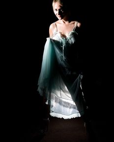 Tiffany is posing in blue negligee