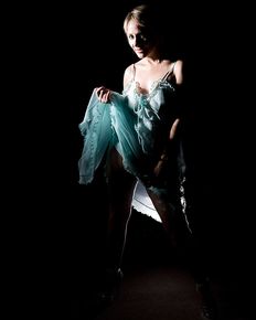 Tiffany is posing in blue negligee