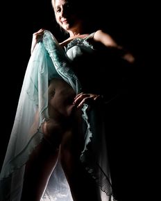 Tiffany is posing in blue negligee