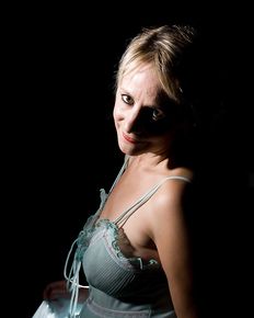 Tiffany is posing in blue negligee