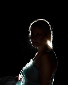 Tiffany is posing in blue negligee