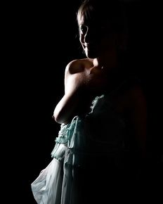 Tiffany is posing in blue negligee