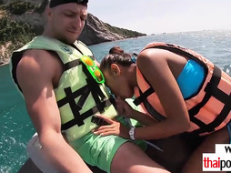 Inexperienced Thai nubile Virgin fellating a yam-sized white dinky on a jet ski