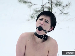 Naked barefoot Claudia chained in the snow