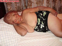 Old grandmother lounging on the bed