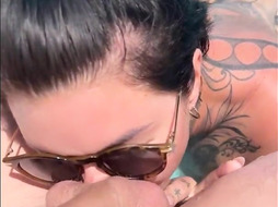 Tattooed british MILF pool blowjob