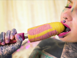 Tattooed girl fingering her pussy and ass